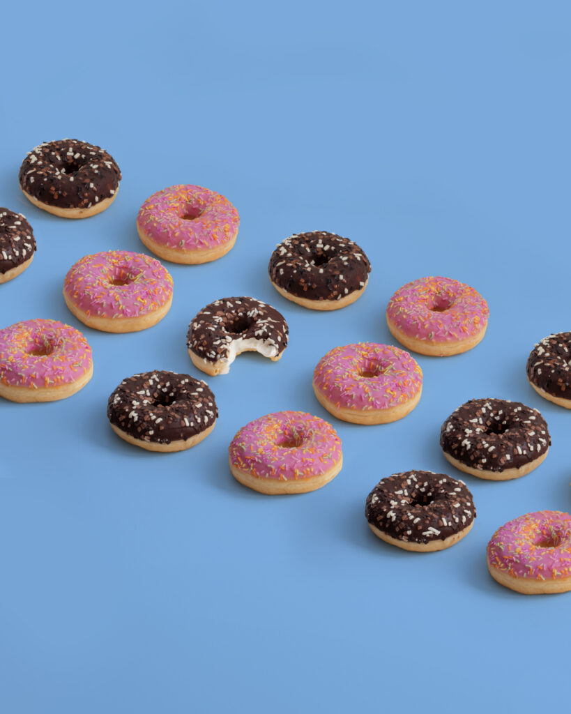 strawberry and chocolate donuts on a blue background